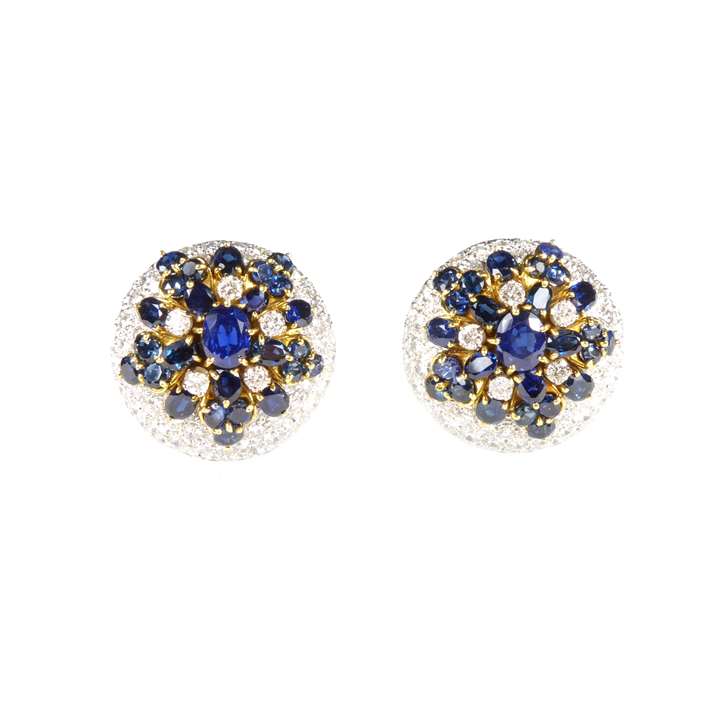 Pair of sapphire and diamond snowflake style cluster dome earrings, c.1970,